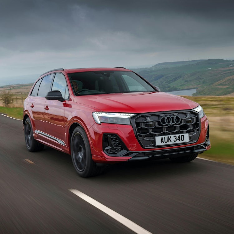 2025 Audi Q7 RHD red exterior front three quarter view driving square image